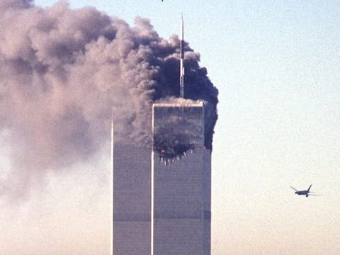  A hijacked commercial aircraft approaches the twin towers of the World Trade Center shortly before crashing into the landmark skyscraper in New York. 