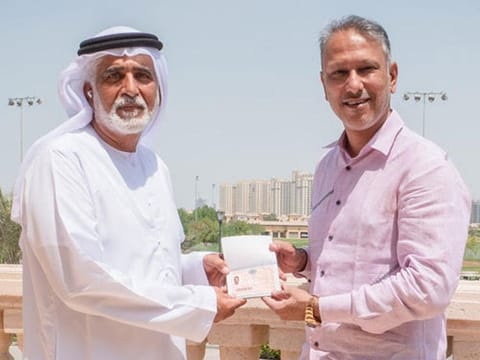 Indian golfer Jeev Milkha Singh receiving his Dubai Golden Visa from Ismail Sharif, Managing Director of Jumeirah Golf Estates. 