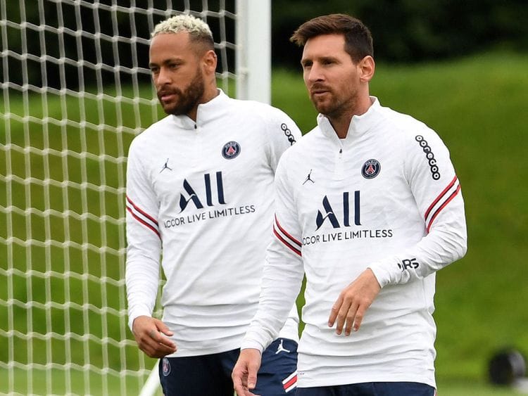 Paris Saint-Germain's Lionel Messi in training with teammate Neymar
