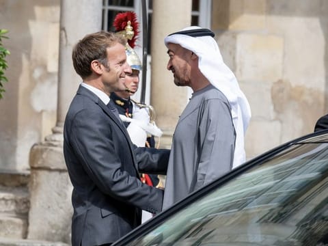 His Highness Sheikh Mohamed bin Zayed Al Nahyan, Crown Prince of Abu Dhabi and Deputy Supreme Commander of the UAE Armed Forces [R] was received by French President Emmanuel Macron [L]