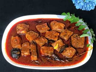 Traditional Kerala recipe for Meen Vevichathu or red fish curry 