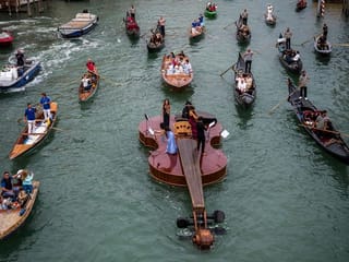 Photos: Giant floating violin makes its maiden voyage in Venice