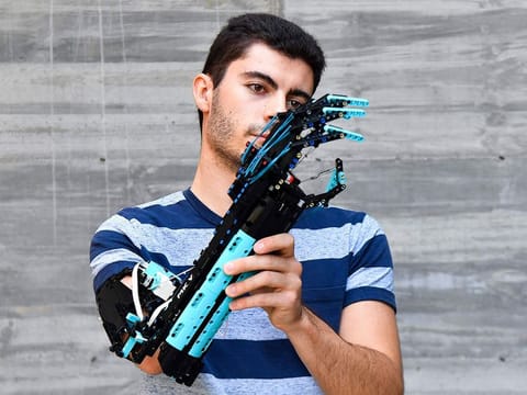 2017 Guinness World record holder and 2020 Lego Masters France winner, Andorran university student David Aguilar, 22, affected by Poland syndrome, poses with his self-built prosthetic arm, made with Lego pieces.