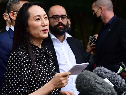 Huawei chief financial officer Meng Wanzhou (centre) talks to media at British Columbia Supreme Court after her extradition hearing ended in her favour, in Vancouver British Columbia, Canada on September 24, 2021. 