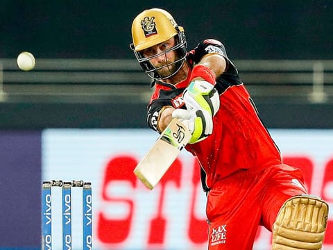 Glenn Maxwell of Royal Challengers Bangalore strikes a boundary against the Rajasthan Royals during the Indian Premier League game at the Dubai International Stadium on September 29, 2021. 