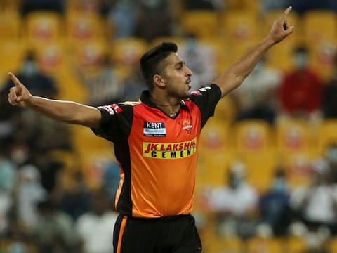 Umran Malik of the Sunrisers Hyderabad celebrates after claiming the wicket of Royal Challengers Bangalore’s K.S. Bharat in the IPL 2021 game in Abu Dhabi on October 6, 2021.