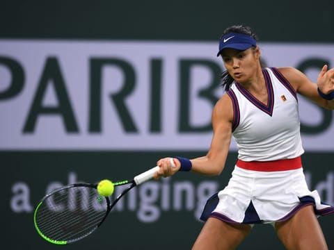 Emma Raducanu hits a shot against Aliaksandra Sasnovich at Indian Wells Tennis Garden. 