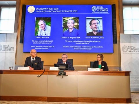 Goran K. Hansson (centre), Permanent Secretary of the Royal Swedish Academy of Sciences, and Nobel Economics Prize committee members Peter Fredriksson and Eva Mork give a press conference to announce the winners of the 2021 Sveriges Riksbank Prize in Economic Sciences in Memory of Alfred Nobel at the Royal Swedish Academy of Sciences in Stockholm, on October 11, 2021. 