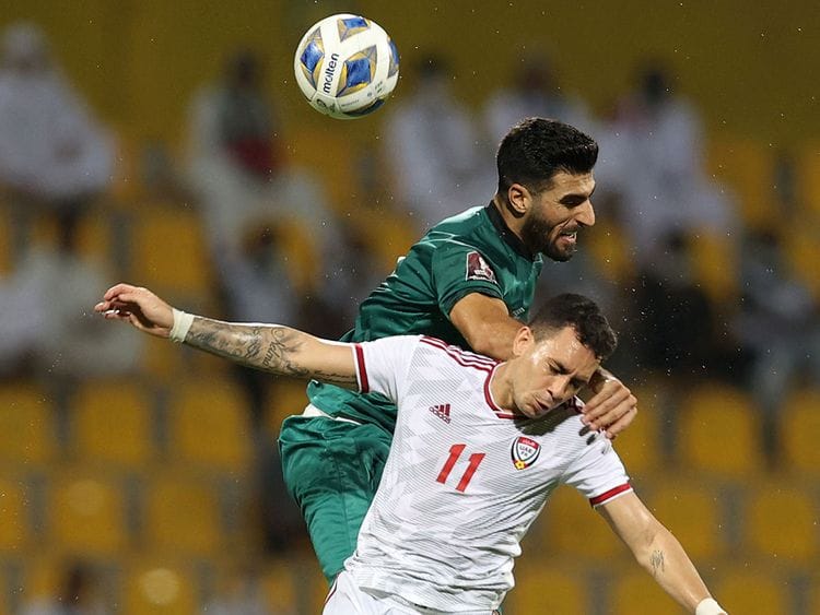 The UAE's Caio Jr battles with Iraq's defender Ahmed Khalaf during the 2022 Qatar World Cup Asian Qualifiers at the Zabeel Stadium in Dubai