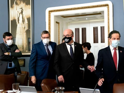 Rep. Jamie Raskin (D-Md.), right, followed by Rep. Jim McGovern (D-Mass.), depart a markup of the Senate Amendment to raising the debt ceiling at the Capitol in Washington on Tuesday, Oct. 12, 2021. 