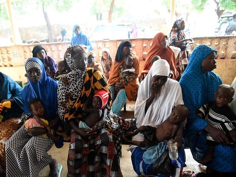 File photo: Mothers with acute malnurished babies sit waiting for medical attendtion at primary health clinic, Glgwai Sokoto North in northwest Nigeria, on September 21, 2021. 