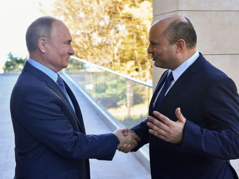 Russian President Vladimir Putin, left, welcomes Israeli Prime Minister Naftali Bennett in Sochi, on October 22 2021. 