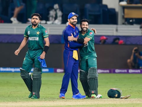 Pakistan captain Babar Azam (left) and Mohammad Rizwan with Indian captain Virat Kohli after their 10-wicket win in their opening match of Super-12 in ICC T20 World Cup match in Dubai.