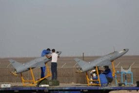 A handout photo made available by the Iranian Army press office on October 21, 2021 shows military personnel inspecting drones during a military exercise at an undisclosed location in Iran. A drone 'from Iran' reportedly crashes into Iraqi Kurdistan home, killing two persons, according to Iraqi authorities.