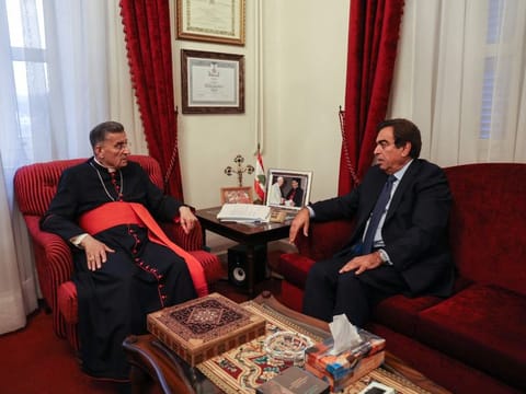 Lebanon's Information Minister Georges Kordahi meets with Cardinal Bechara Al Rai at the Maronite Patriarchate in the mountain village of Bkerki, northeast of the capital, on October 30, 2021. 
