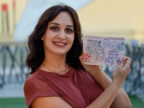 Ukrainian expat Kateryna Sakovich shows off her Expo 2020 Dubai Passport filled with all 217 pavilion stamps