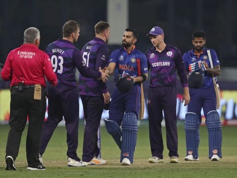 India's captain Virat Kohli greets Scotland's players after India won the Cricket Twenty20 World Cup match in Dubai, UAE.