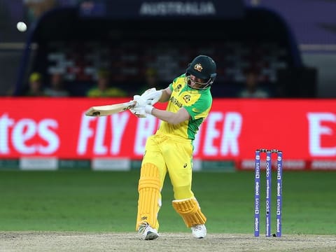 Australia's David Warner, who became the Man of the Tournament, in full flow against New Zealand in the final of the T20 World Cup at the Dubai International Stadium.