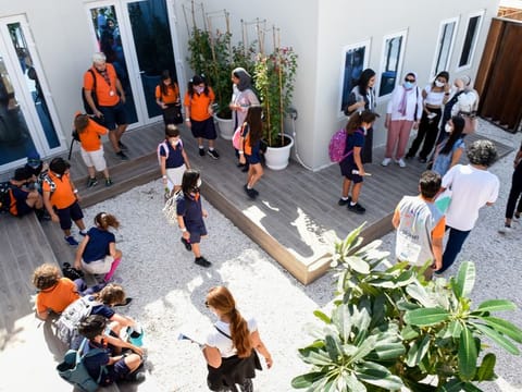 Students tour a smart home model at the 2021 Solar Decathlon Middle East in Dubai on Tuesday