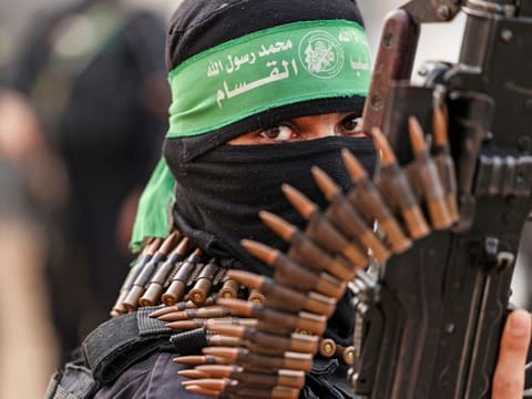 A member of Ezzedine Al Qassam Brigades, military wing of the Palestinian Hamas movement, takes part in a parade in Gaza City on November 14, 2021. 