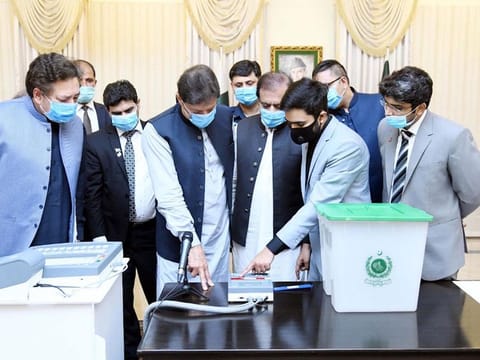  PM Imran Khan inspects EVMs developed by the Minister of Science and Technology in this August 5, 2021 picture.