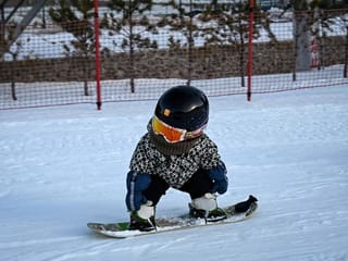 Photos: Snowboarding baby steals hearts and headlines in China