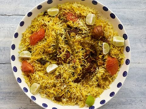 Traditional Emirati recipe for Malleh Fogah or slow-cooked rice with salted fish 