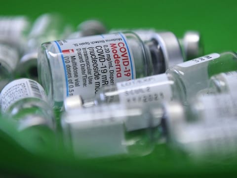Empty vials of the COVID-19 vaccine lie in a tray at a vaccination centre in Sonthofen, southern Germany, on November 30, 2021.