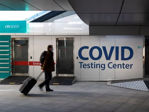 A passenger walks past a Covid-19 testing center in Incheon International Airport in Incheon, South Korea.