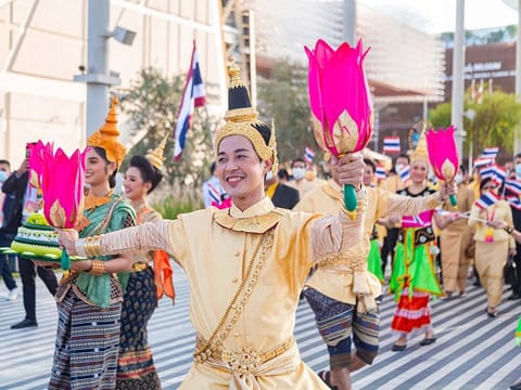 The Smile Parade saw visitors joining a march of Thailand Pavilion representatives, ambassadors, performers and musicians