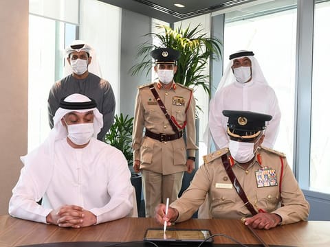 Expert Major General Khalil Ibrahim Al Mansouri, Assistant Commander-in-Chief for Criminal Investigation Affairs at Dubai Police (R), and Ali Faisal Ba'Alawi, Head of the UAE Financial Intelligence Unit, signing the MoU at Expo 2020 Dubai on Wednesday
