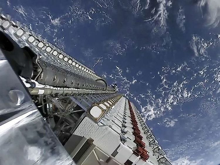 A fleet of SpaceX Starlink internet satellites is seen in this image poised for deployment in orbit from a May 24, 2019 launch.