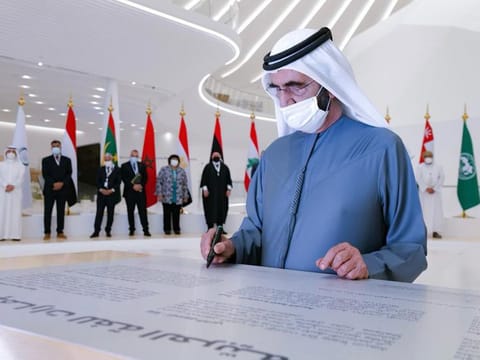 Sheikh Mohammed bin Rashid Al Maktoum signing the UAE Declaration on the Arabic Language on Sunday at the Arabic Language Summit at Expo 2020 Dubai