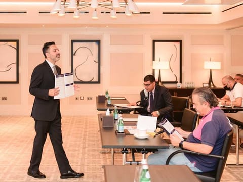 Shai Zamanian, Legal Director of The American Legal Center, at a session with clients