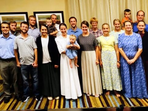 A photo of the 17 freed hostages taken in Florida is seen at the press conference at Christian Aid Ministries home office in Berlin, OH on December 20, 2021. 