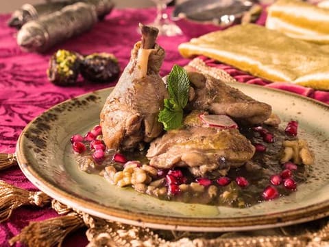 Khoresht Anar or Iranian braised chicken with pomegranate and walnuts