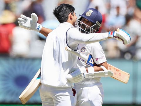 India's Ajinkya Rahane, right, and teammate Shubman Gill embrace as they celebrate after winning the second Test against Australia at the Melbourne Cricket Ground. 