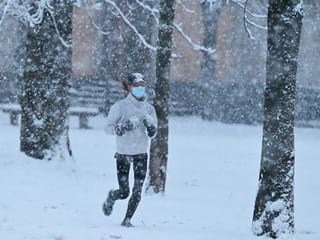 Photos: Rare snowfall blankets locked-down Milan 