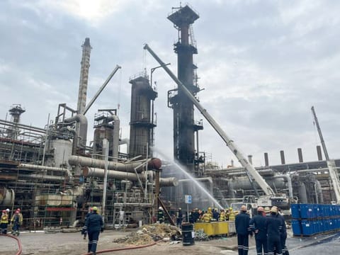 Firefighters extinguishing a fire at Al Ahmadi refinery south of Kuwait City on January 14, 2022. 