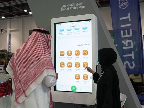 A visitor learns about Dubai Police smart services at Intersec at Dubai World Trade Centre 