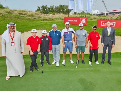 Padraig Harrington, centre, with the UAE Special Olympics golfers Vincent Baur, Gabby Snowden, Saif Al Qubaisi and Ali bin Sumadiaa, coach Karl Dunn, Talal Al Hashimi, National Director of Special Olympics, and Greg Fewer, CFO - Aldar Properties, at the Special Olympics Golf Clinic at Yas Links