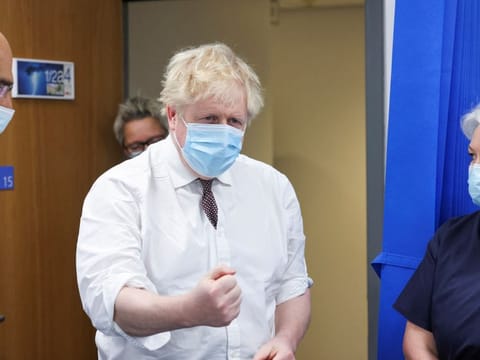 Britain's Prime Minister Boris Johnson visits Finchley Memorial Hospital, an NHS (National Health Service) community hospital, in North London, on January 18, 2022. To trigger a leadership challenge, 54 of the 360 Conservative MPs in parliament must write letters of no confidence to the chairman of the party’s 1922 Committee.