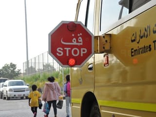 Motorists urged to stop completely at school bus stop signs as students head back to campus