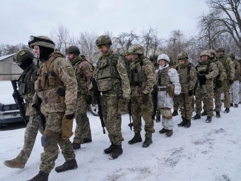 Members of Ukraine's Territorial Defence Forces, volunteer military units of the Armed Forces, train in a city park in Kyiv, Ukraine, Saturday, Jan. 22, 2022.