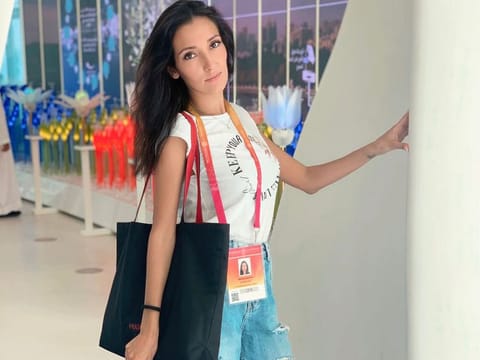 Russian national Cristina Mokrova works as a hostess at a restaurant at Expo 2020 Dubai.