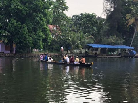 Tourists and locals enjoy a row boat ride at the Punnamada Lake.