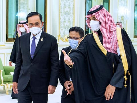 Saudi Crown Prince Mohammed bin Salman, right, welcomes Thai Prime Minister Prayuth Chan-ocha, at the royal palace in Riyadh, Saudi Arabia, Tuesday, Jan. 25, 2022. 