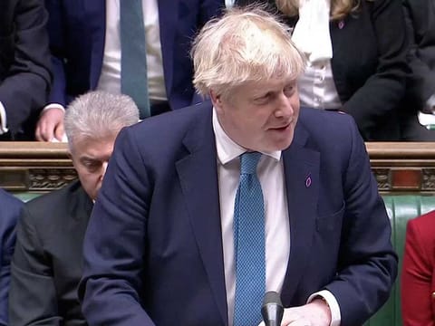 British Prime Minister Boris Johnson speaks during the weekly question time debate at Parliament in London, Britain, January 26, 2022, in this screen grab taken from video. 