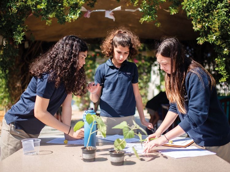 American School of Dubai students conduct an experiment in this February 2020 photo