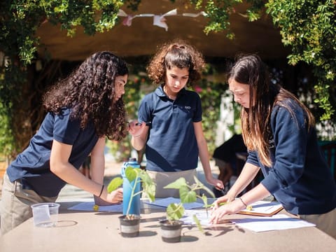 American School of Dubai students conduct an experiment in this February 2020 photo